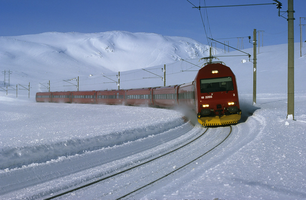 Bergensbanen train on the mountain section near Myrdal station with snow and fjord valley visible