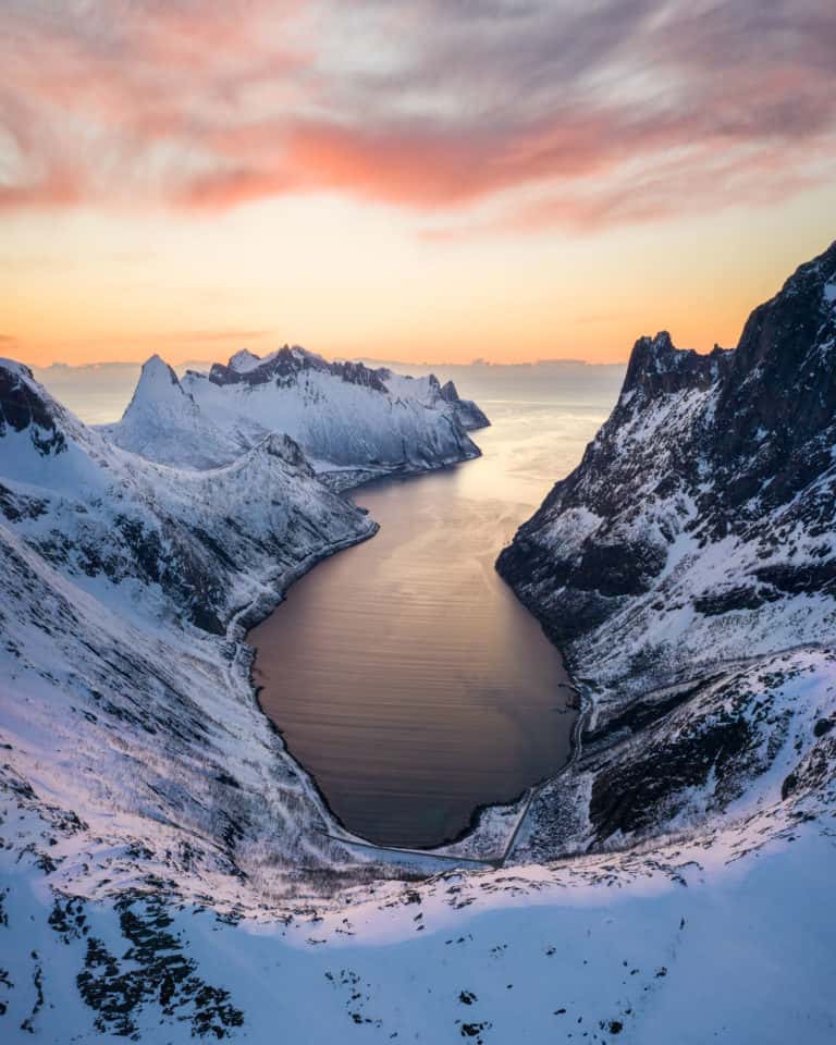 Senja island panorama with jagged peaks dropping into a fjord