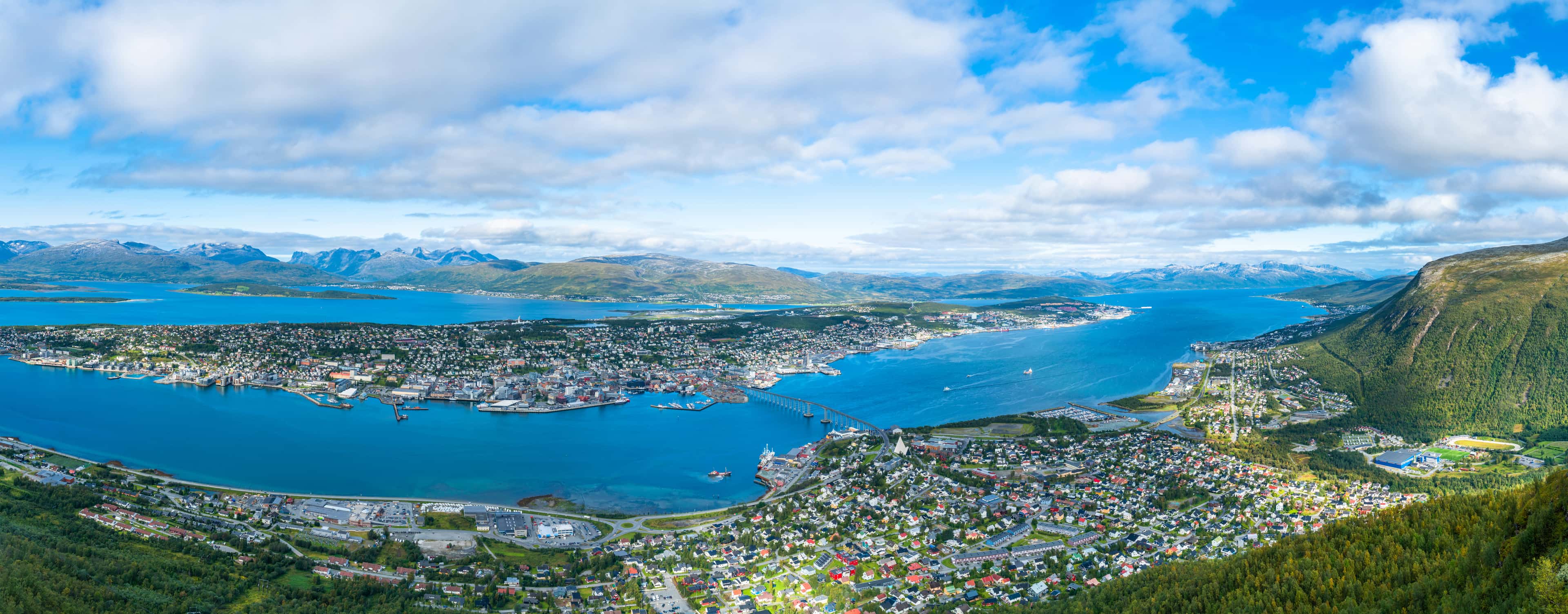 Tromsø cityscape and harbour at night with Northern Lights — Arctic Norway