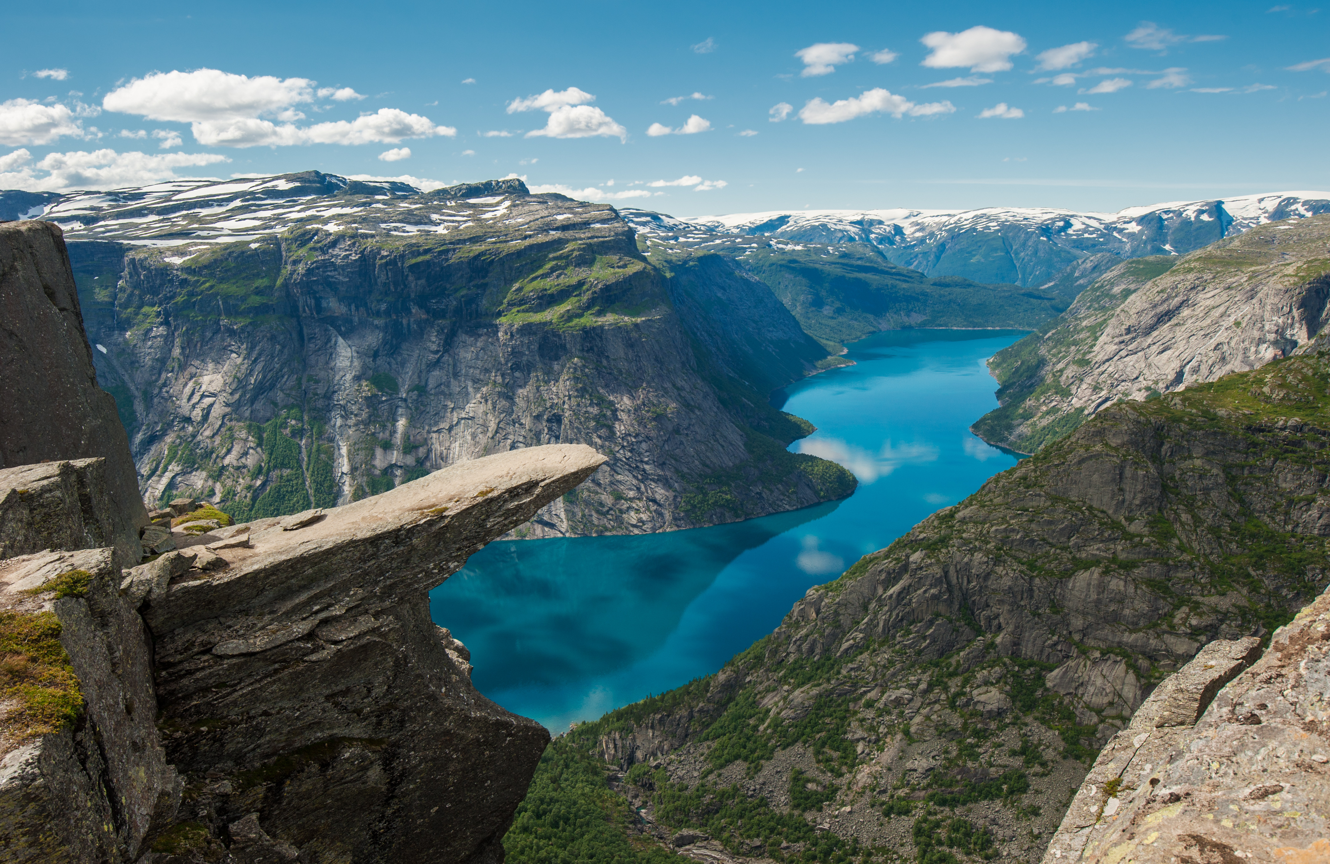 Trolltunga rock ledge projecting horizontally from the cliff 700 meters above Ringedalsvatnet