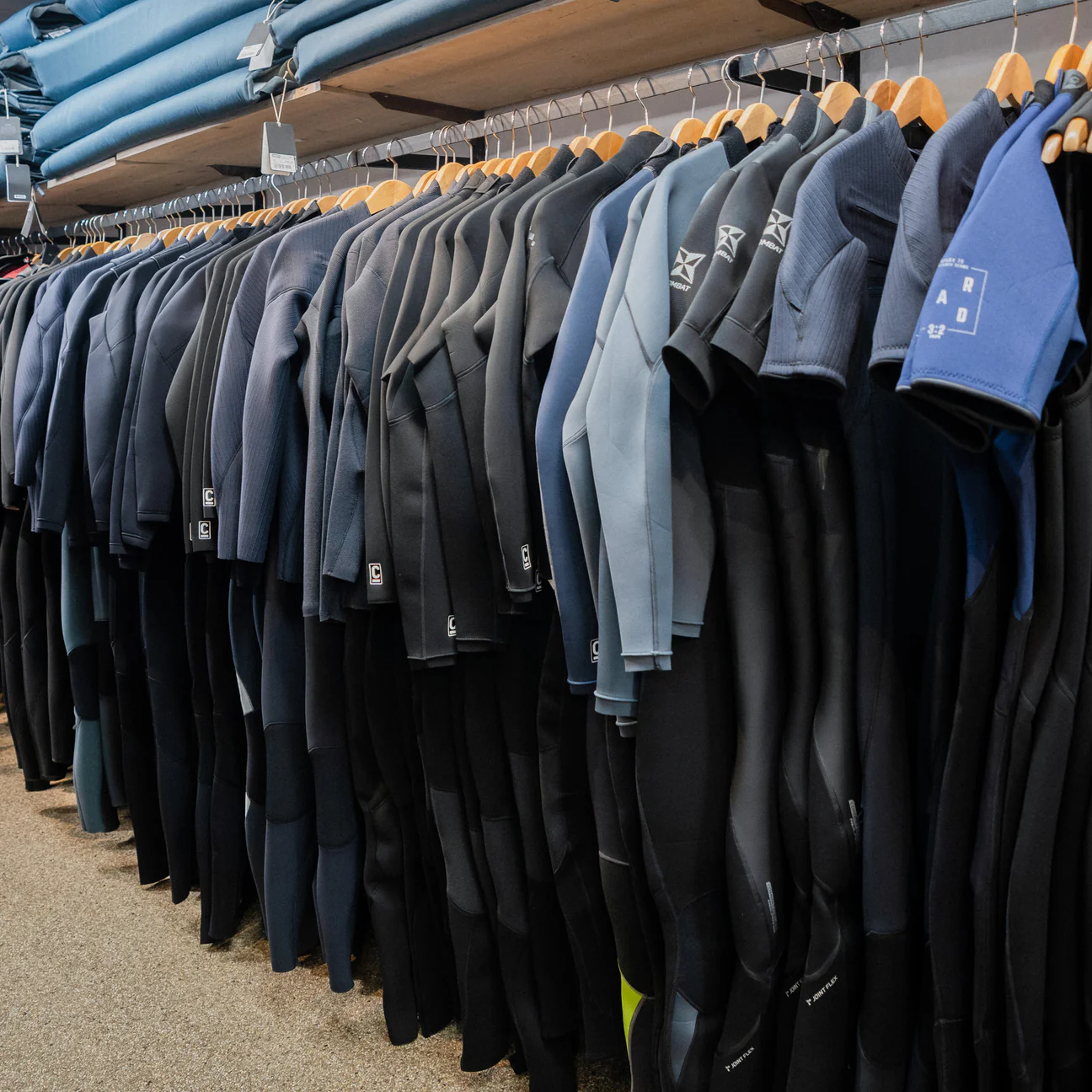 Kayaker in provided paddling gear on Nærøyfjord. Wetsuit, splash jacket, and buoyancy aid issued for the Nordic Ventures half-day tour from Gudvangen.
