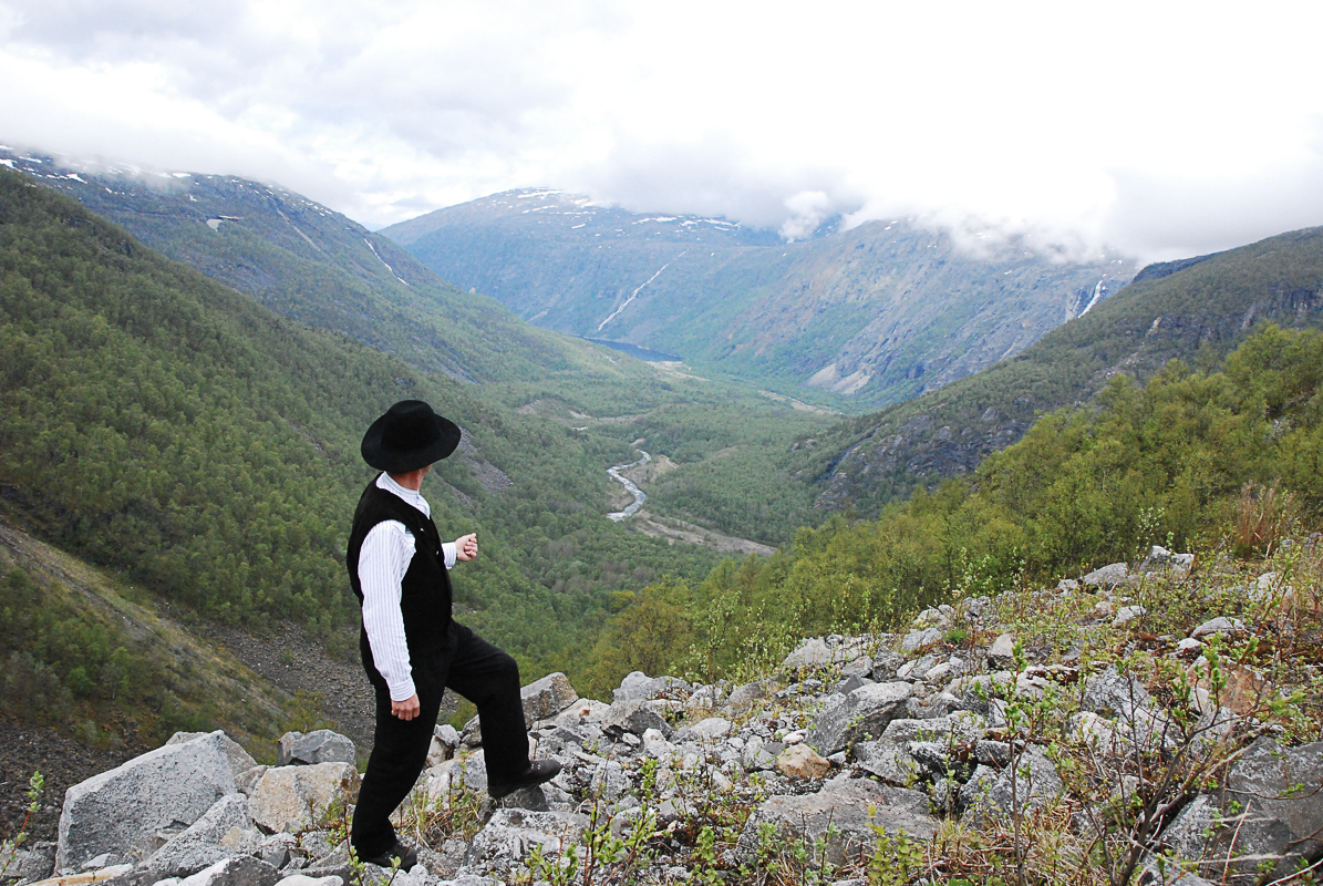 Hikers on the Rallarveien trail near Narvik with mountain terrain ahead